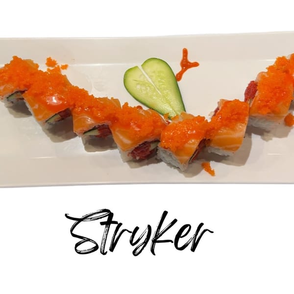 Koibito One Sushi & Teriyaki's Stryker roll, a salmon and tuna sushi roll topped with orange tobiko.