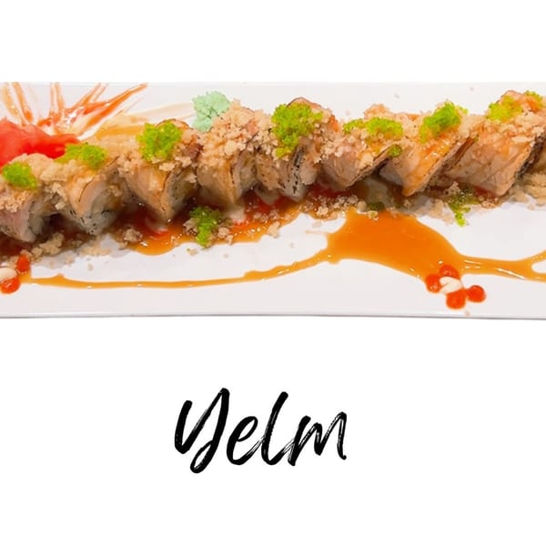 Koibito One Sushi & Teriyaki's sushi roll, topped with green roe and tempura flakes, drizzled with sauce.