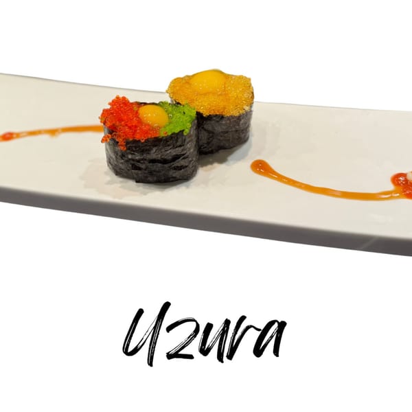 Two Koibito One Sushi & Teriyaki Uzura sushi pieces with colorful roe and quail egg on a white plate.