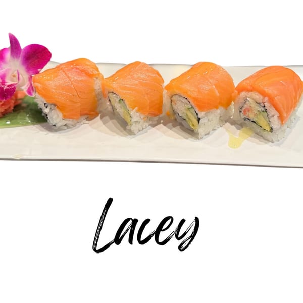 Four Lacey sushi rolls with salmon, avocado, and crab, garnished with an orchid.
