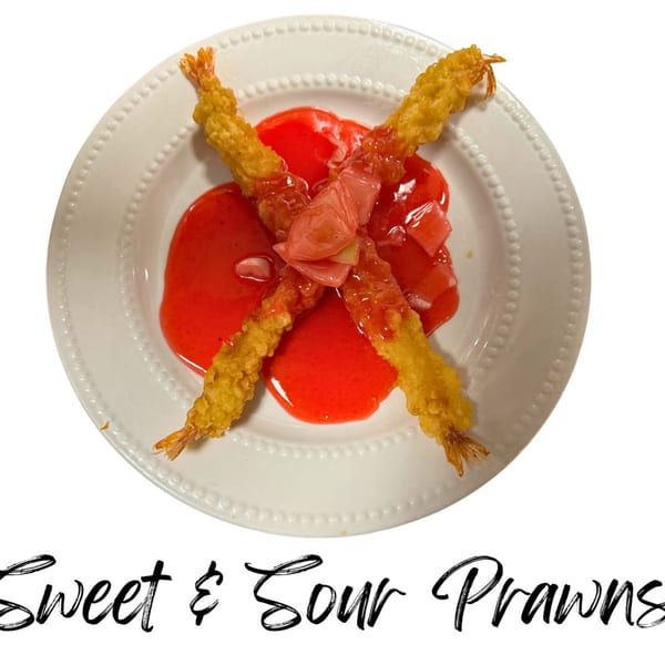 Sweet & Sour Prawns from Koibito One Sushi & Teriyaki, featuring crispy fried shrimp with red sauce.