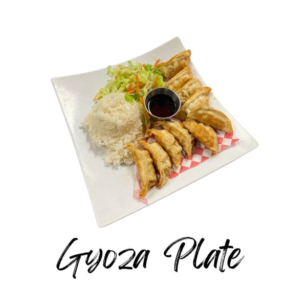 A Koibito One Gyoza Plate with fried dumplings, white rice, salad, and dipping sauce.
