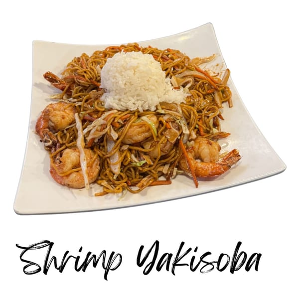 Shrimp Yakisoba with noodles, vegetables, and a scoop of white rice on a white plate.